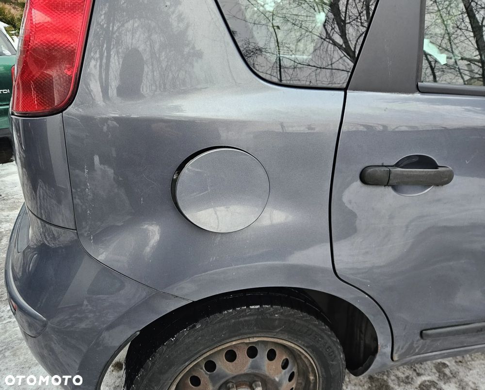 Nissan Note E11 07 błotnik tył tylny  prawy lewy B52G - 2