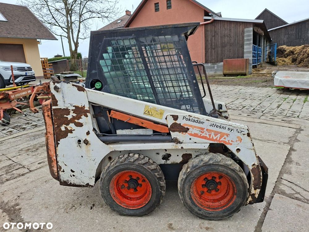 Bobcat 553 4X4 + Melroe Ingersoll-Rand 725S B/H - 4