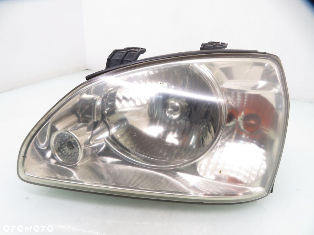 LAMPA LEWA PRZEDNIA KIA CARENS II - 7
