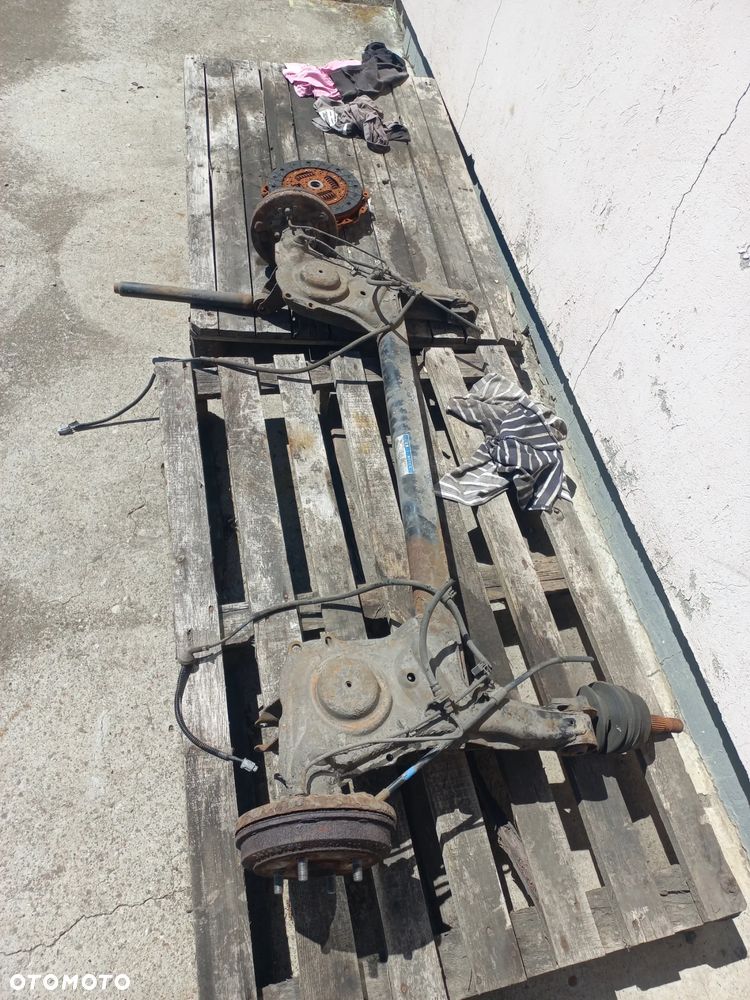 Daihatsu Cuore 1.0 B 03r belka zawieszenia tylnego kompletna