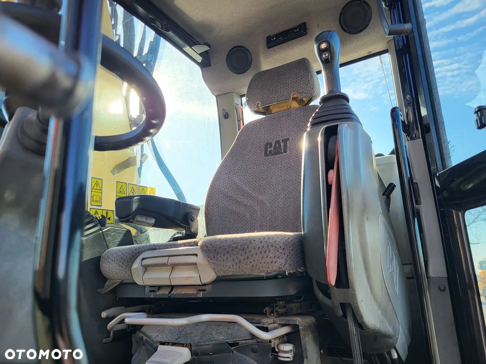 Caterpillar M 318F / z Niemiec /  9300 mth / - 8