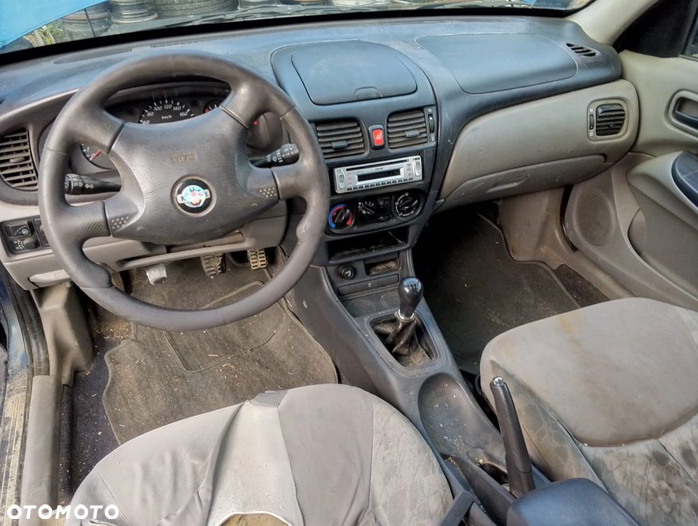 Nissan Almera N16 (00-02.) 1.5 B 89KM. Silnik QG15DE Skrzynia 4M40.Cały na części. GWARANCJA !!! Przód Tył Zestaw Komplet Drzwi Klapa Zderzak Błotnik Maska Grill Atrapa Szyba Pas Lampa Lusterko Boczki Fotel Kanapa Kokpit Deska Rozdzielcza Przełącznik Włącznik Sterownik Przewody Wiązka Instalacja Moduł Komputer Czujnik Listwa Pompa Alternator Wtryski Głowica Rozrusznik Kompresor Sprzęgło Dwumas Silnik Skrzynia ABS Klimatyzacji Paliwa Wspomagania Kolektor Turbina Przepustnica Zawór Chłodnica Koło Hak Belka Sanki Zawieszenie Mcpherson Półoś Amortyzator Wydech Tłumik Zacisk Most - 7