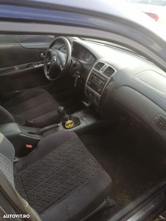 Dezmembrez Mazda 323 - 7