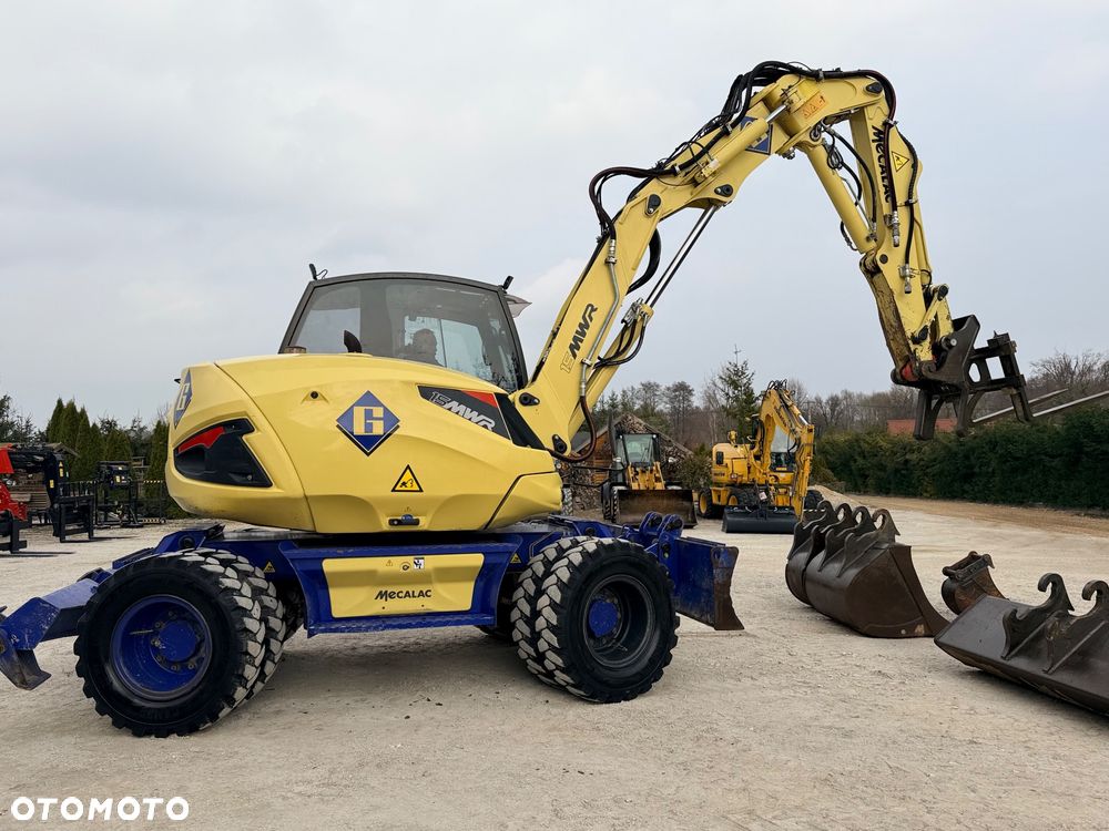 Mecalac Koparka 14 ton MECALAC 15 MWR koparko-ładowarka 3 łyżki widły 1 wł Centr.smarowanie Opony na BLIŹNIAKU 80%Camso ładowarka 714 12MTX 4x4 skrętne KLIMA kabina Premium silnik 146KM volvo EW140B DEUTZ szybka 35km/h - 22
