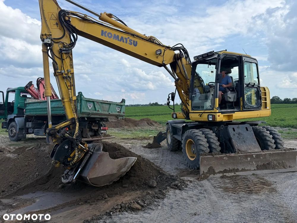 Komatsu Koparka kołowa Komatsu PW 148 Pług podpory Klima Centralne smarowanie Rototil Ramię 2 razy łamane PIĘKNA - 35