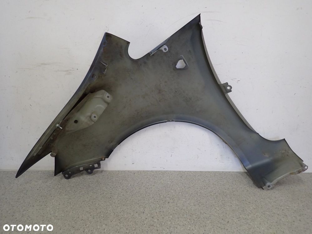 MITSUBISHI COLT 5d 09-12 BŁOTNIK PRZEDNI PRAWY D09 - 12