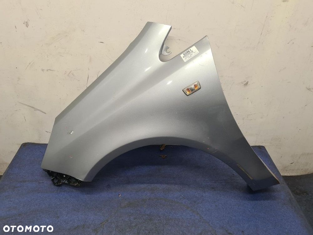 OPEL CORSA D BŁOTNIK PRZÓD LEWY - 1