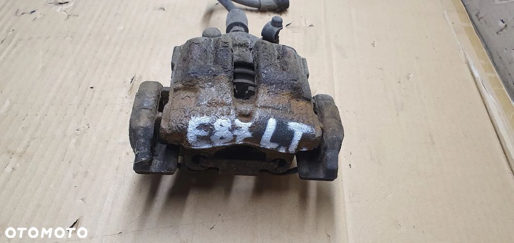 Zacisk hamulcowy lewy tył tylny BMW I E87 - 3