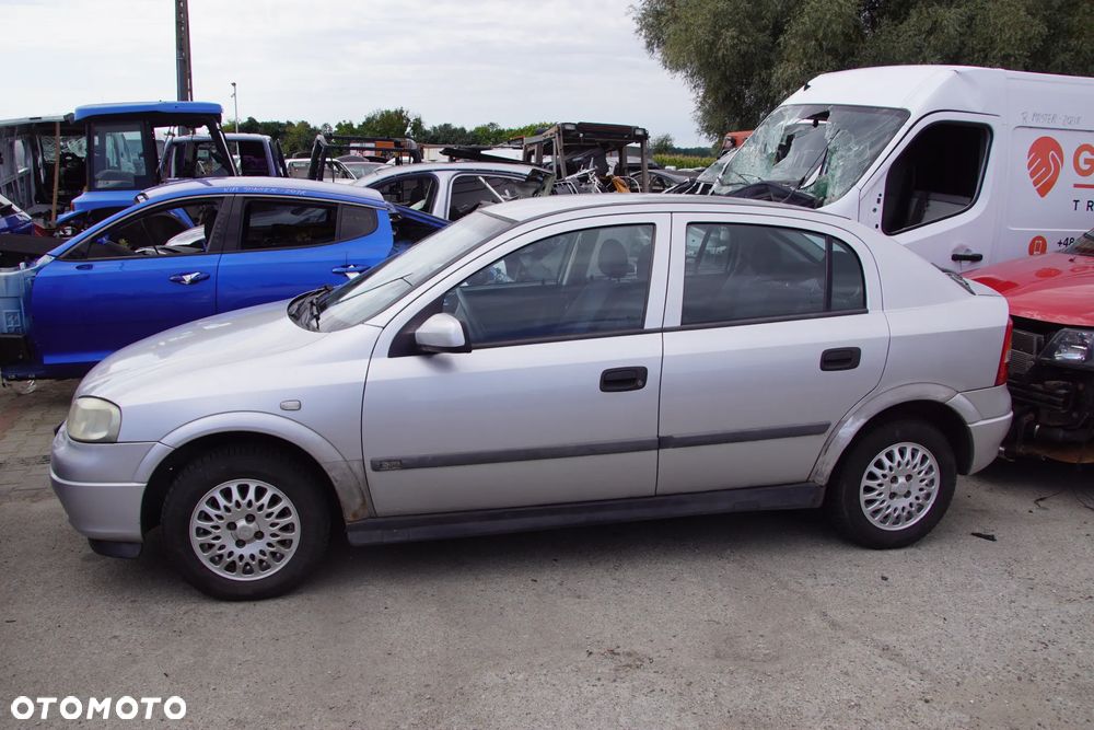 Auto na części - Opel Astra II G 1.6 16V 101 KM X16XEL F17 Z147 1999R Silnik Skrzynia Drzwi Maska Błotnik Zderzak Klapa Lampa Lusterko Klamka Szyba Deska Kokpit Sterownik Moduł Czujnik Licznik Panel Kierownica - 2