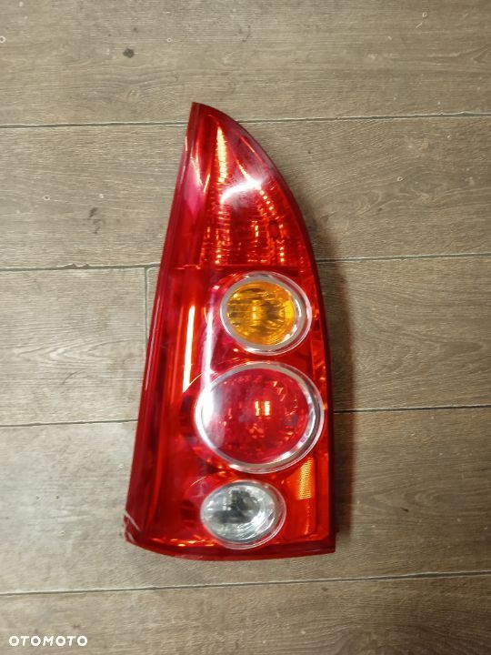LAMPA TYLNA LEWA MAZDA PREMACY 01-06 ORYGINAŁ - 1