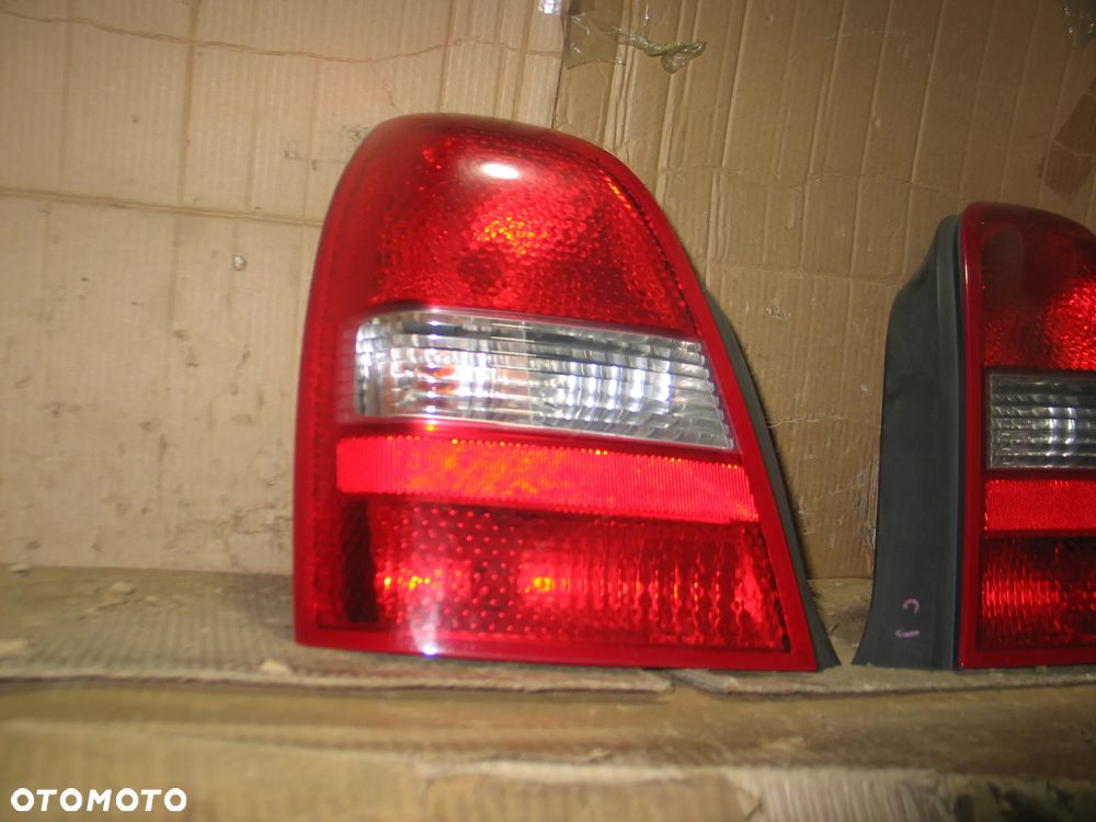lampa tyl prawa lewa nissan primera P12 sedan oryginal - 5