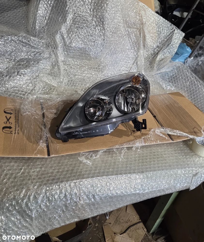 Lampa lewa przód przednia Opel Zafira B Lift 93190408 13252472 Reflektor lewy przód przedni Opel Zafira B Lift - 1