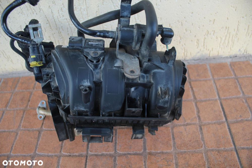 KOLEKTOR SSĄCY OPEL CORSA D 1.0 55557905 0280600062 - 2