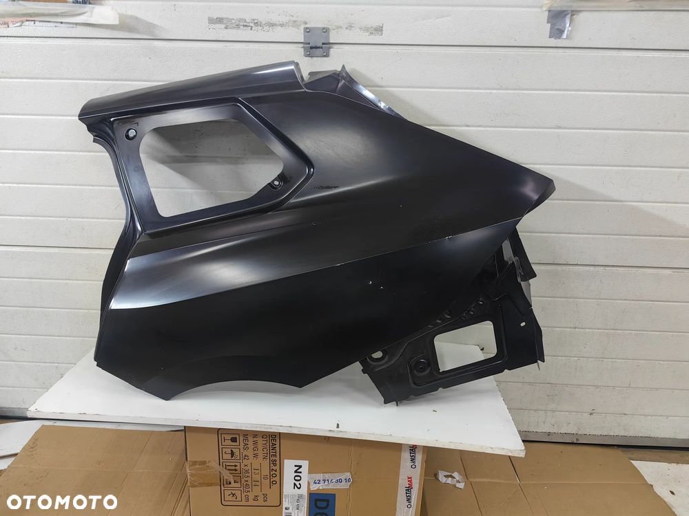 Błotnik tylny lewy Opel Astra L VI kombi - 1