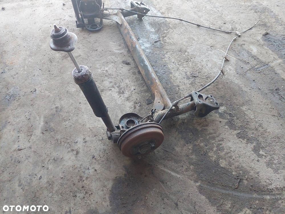 BELKA OŚ ZAWIESZENIA TYŁ BĘBNY BEZ ABS CHEVROLET AVEO I 03-07 HB 5D - 3