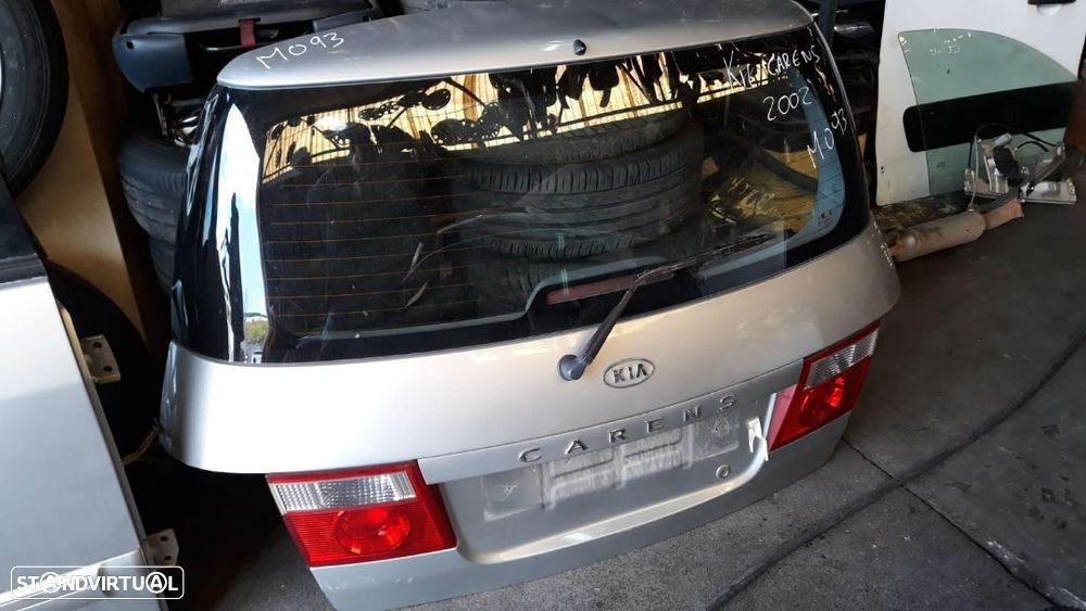 KIA CARENS 2002 - TAMPA DA MALA  M093 - 1