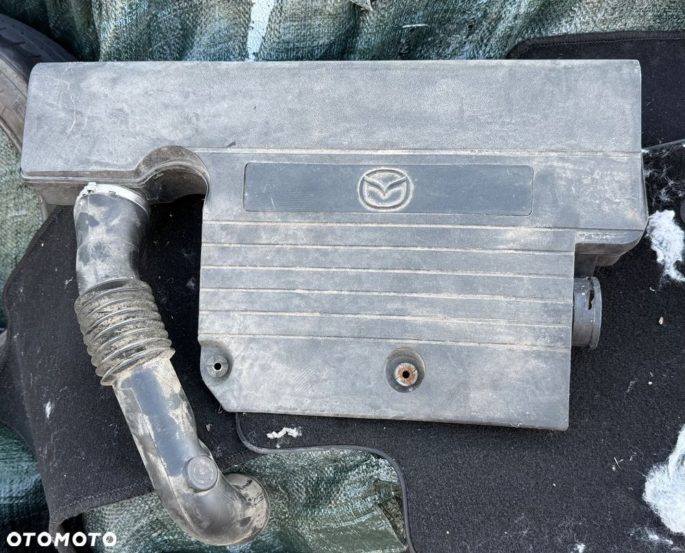 Mazda 2 DY 2003/2006r maska pokrywa silnika 27K  grill wygłuszenie maski belka chlapacze lampy wzmocnienie zderzak tył blotnik kmaska pokrywa silnika drzwi lampy tył  przed lift lub polift czy sport zaslepka Moduł przetwornica Xenon starter cewka ksenon zaslepka - 14