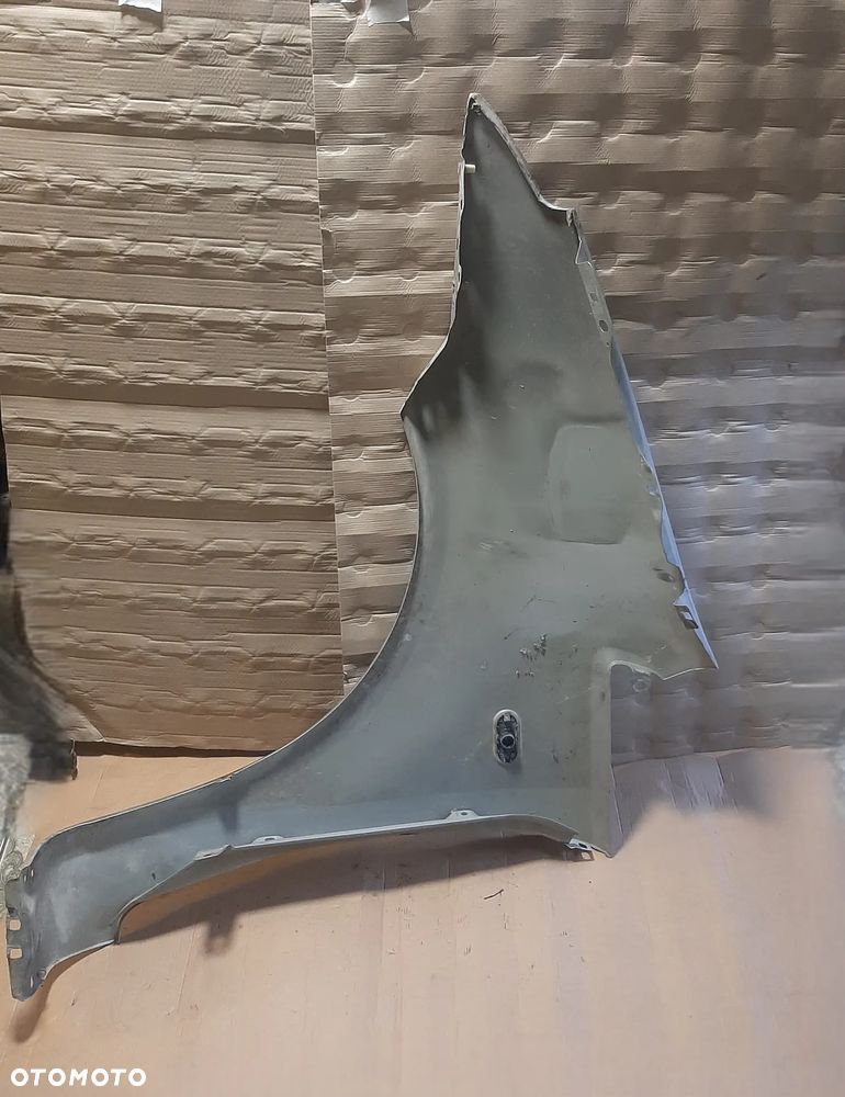 Błotnik  FORD C -MAX 06R prawy  OE - 2