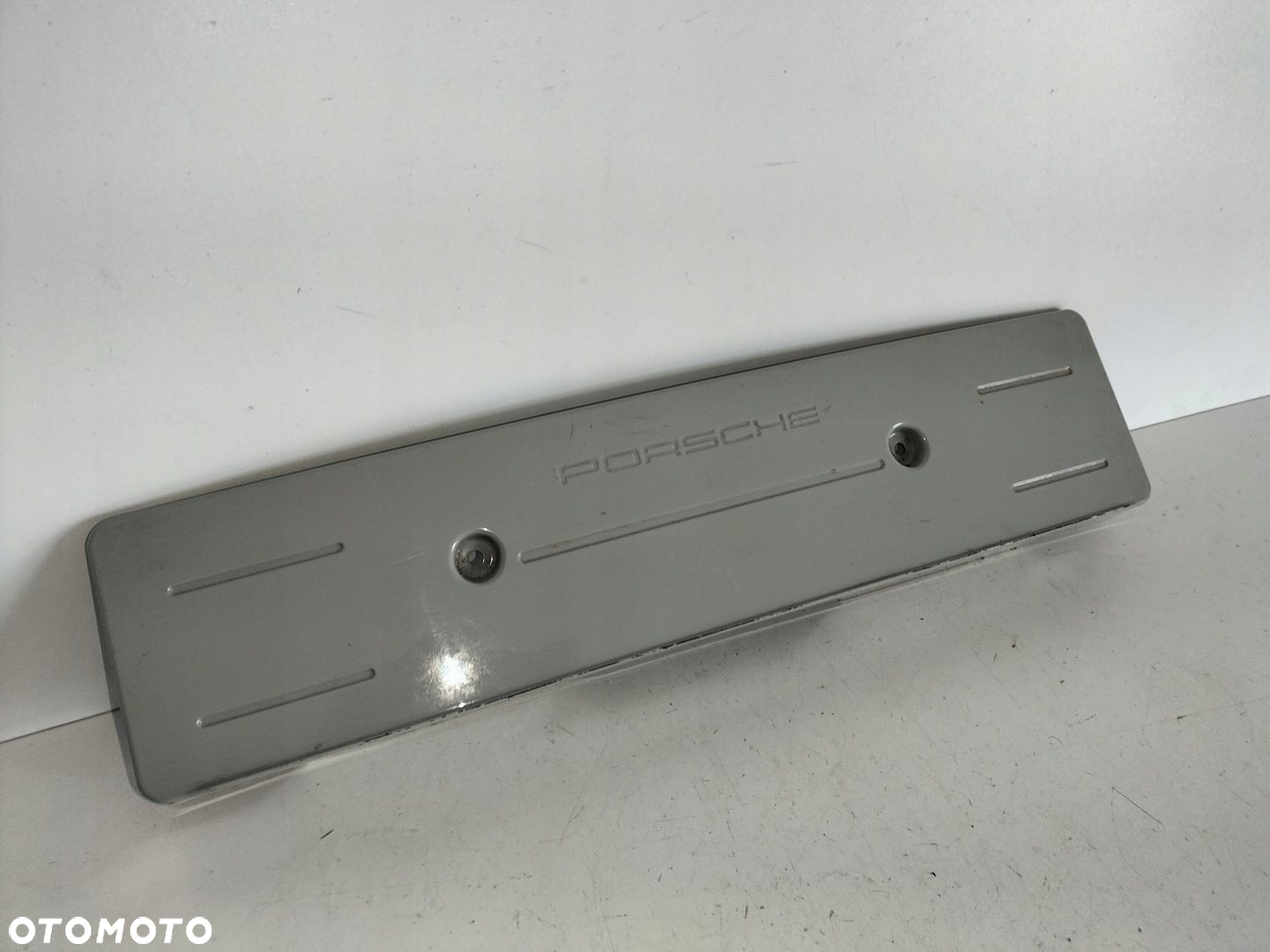 Podkładka pod tablicę rejestracyjną przód PORSCHE PANAMERA II 971 16- - 2
