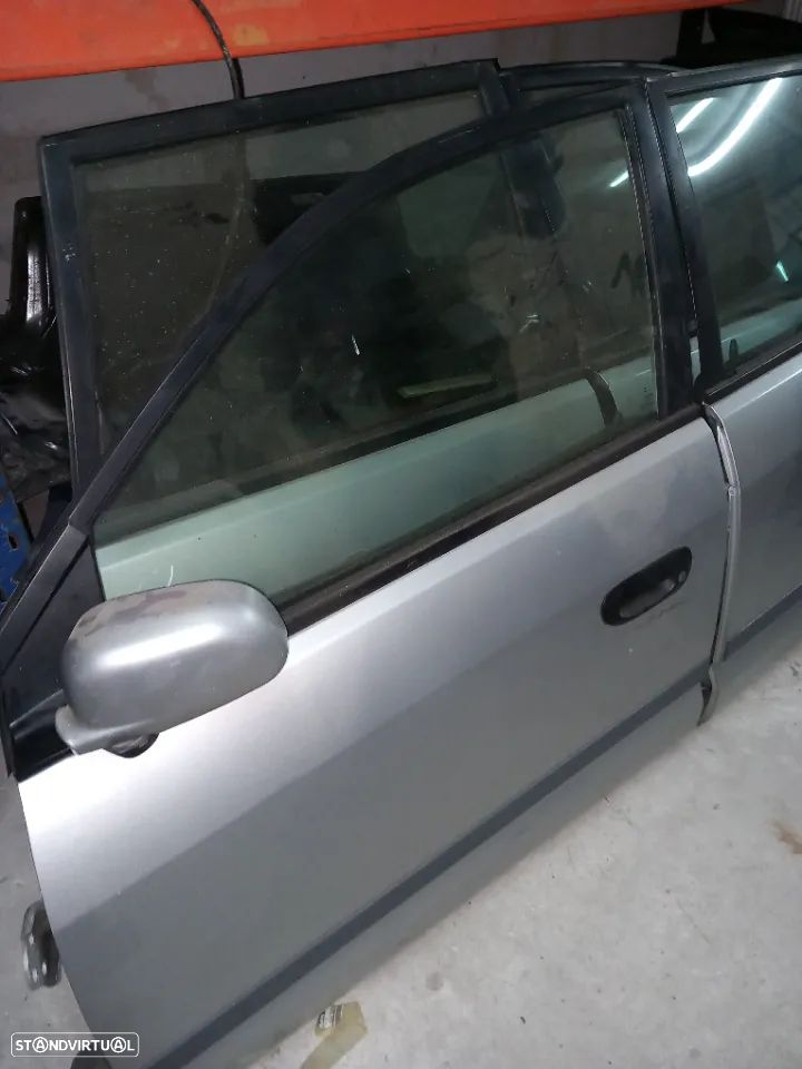 Portas completas lado condutor mitsubishi space star ano 2002 - 4