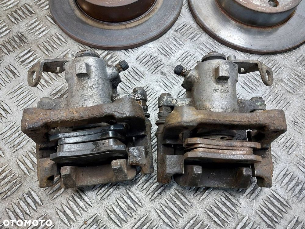 TARCZE HAMULCOWE TYŁ + KLOCKI + ZACISKI VOLKSWAGEN GOLF IV OCTAVIA I - 2