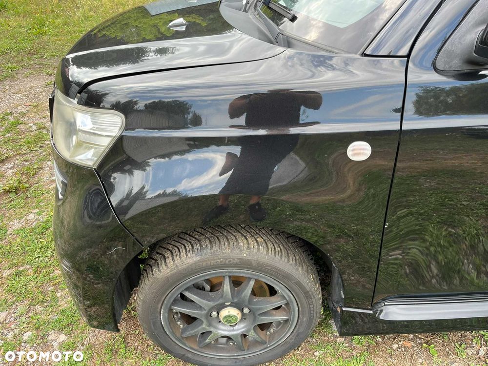 błotnik przód przedni lewy daihatsu materia x07 czarny 2006 - 2011