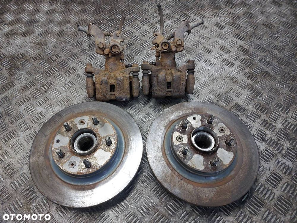 TARCZE HAMULCOWE TYŁ + KLOCKI + ZACISKI PIASTY MAZDA 6 I GG GY - 1