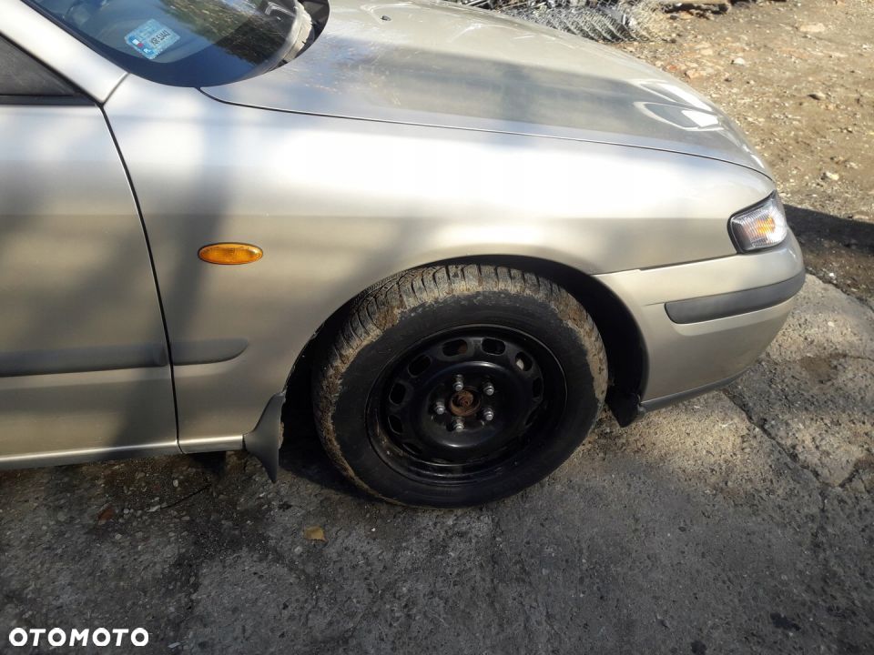 Mazda 626 GF 97-02 błotnik przedni przód Prawy 4f