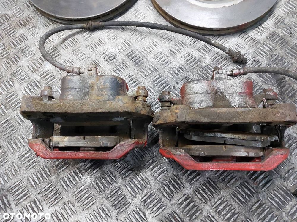 TARCZE HAMULCOWE PRZÓD + KLOCKI + ZACISKI NISSAN QASHQAI I J10 2.0 DCI - 4