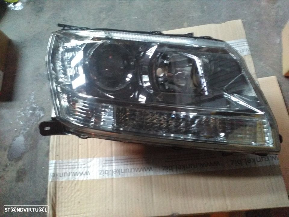 Farol frente grand vitara 2006  novo - 1