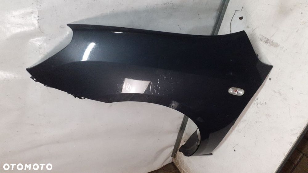 * KIA CARENS 3 III  BŁOTNIK PRZÓD LEWY SZARY 1U - 2