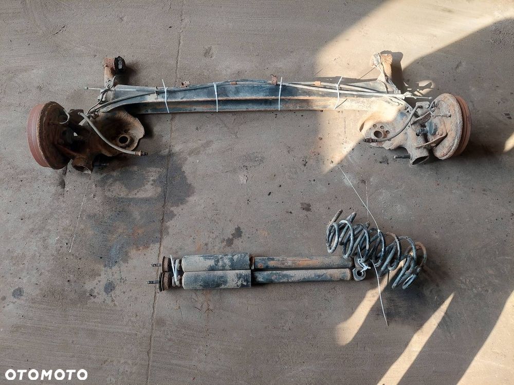 BELKA OŚ ZAWIESZENIA TYŁ BĘBNY Z ABS TOYOTA YARIS I ID: 238000 - 1