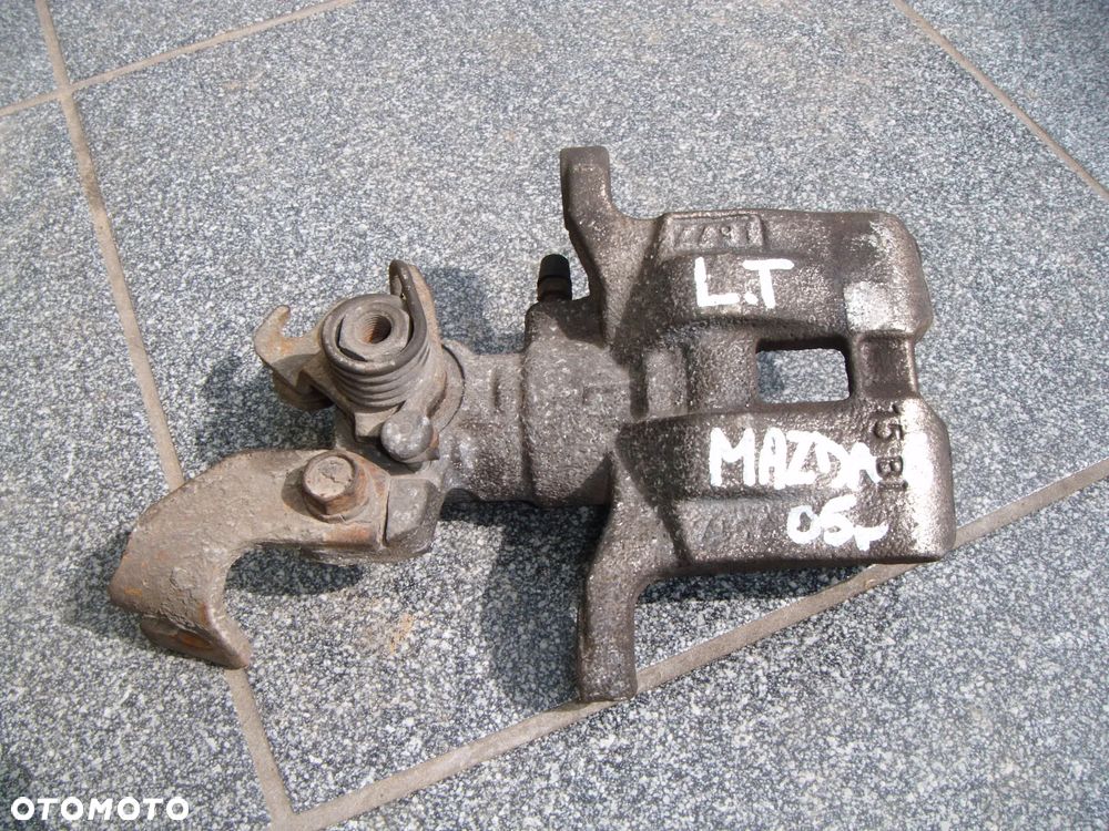 mazda 6 gg 04r zacisk lewy tył - 1