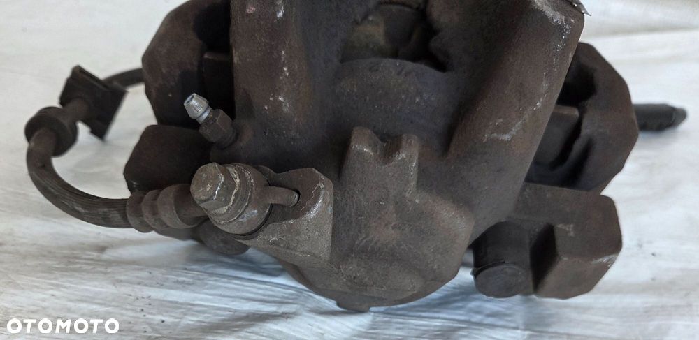 ZACISK HAMULCA LEWY PRZÓD OPEL COMBO E - 4