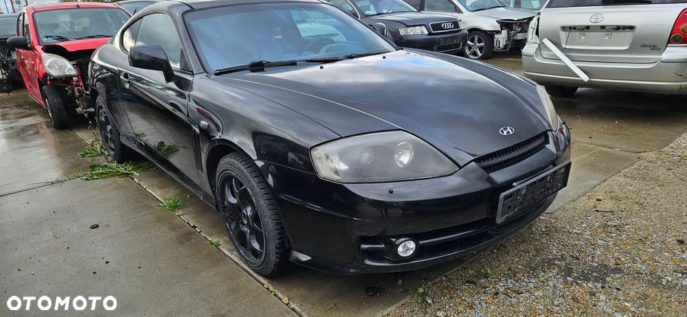 Maska pokrywa Hyundai Coupe II 2003r lak. EB - 1