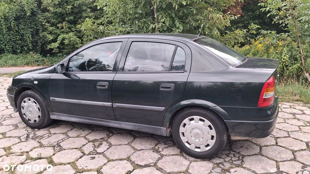 Na części Opel Astra G II SEDAN silnik 1.6 X16XEL Z16XE lakier Z380 skrzynia maska zderzak drzwi klapa szyba fotel kanapa lusterko lampa deska GWARANCJA !!! Przód Tył Zestaw Komplet Drzwi Klapa Zderzak Błotnik Maska Grill Atrapa Szyba Pas Lampa Lusterko Boczki Fotel Kanapa Kokpit Deska Rozdzielcza Przełącznik Włącznik Sterownik Przewody Wiązka Instalacja Moduł Komputer Czujnik Listwa Pompa Alternator Wtryski Głowica Rozrusznik Kompresor Sprzęgło Dwumas Silnik  Skrzynia ABS Klimatyzacji Paliwa Wspomagania Kolektor Turbina Przepustnica Zawór Chłodnica Koło Hak Belka Sanki Zawieszenie Mcpherson Półoś Amortyzator Wydech Tłumik Zacisk Most - 9