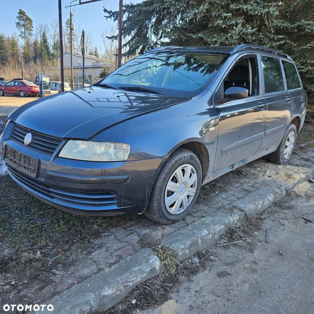 Fiat Stilo 1,6 B 76 kW / 103 KM (2003 kombi) (kod lak: 675) pojazd na części: maska, zderzak, drzwi, szyby, lusterka, chłodnica ... - 1