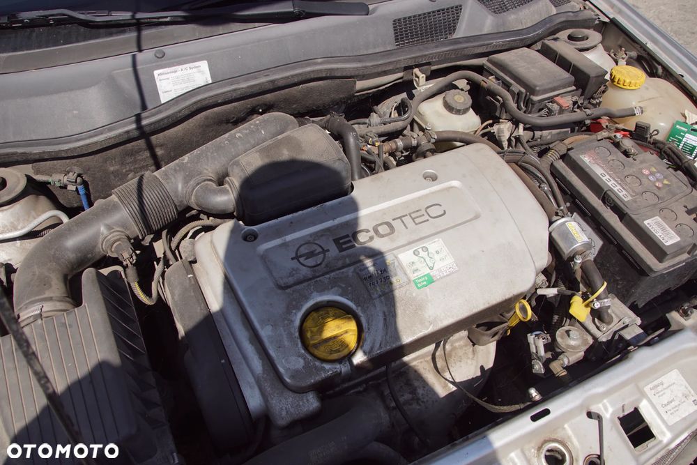 Auto na części - Opel Astra II G 1.6 16V 101 KM Z16XE F17 Z157 2002R Silnik Skrzynia Drzwi Maska Błotnik Zderzak Klapa Lampa Lusterko Klamka Szyba Deska Kokpit Sterownik Moduł Czujnik Licznik Panel Kierownica - 19