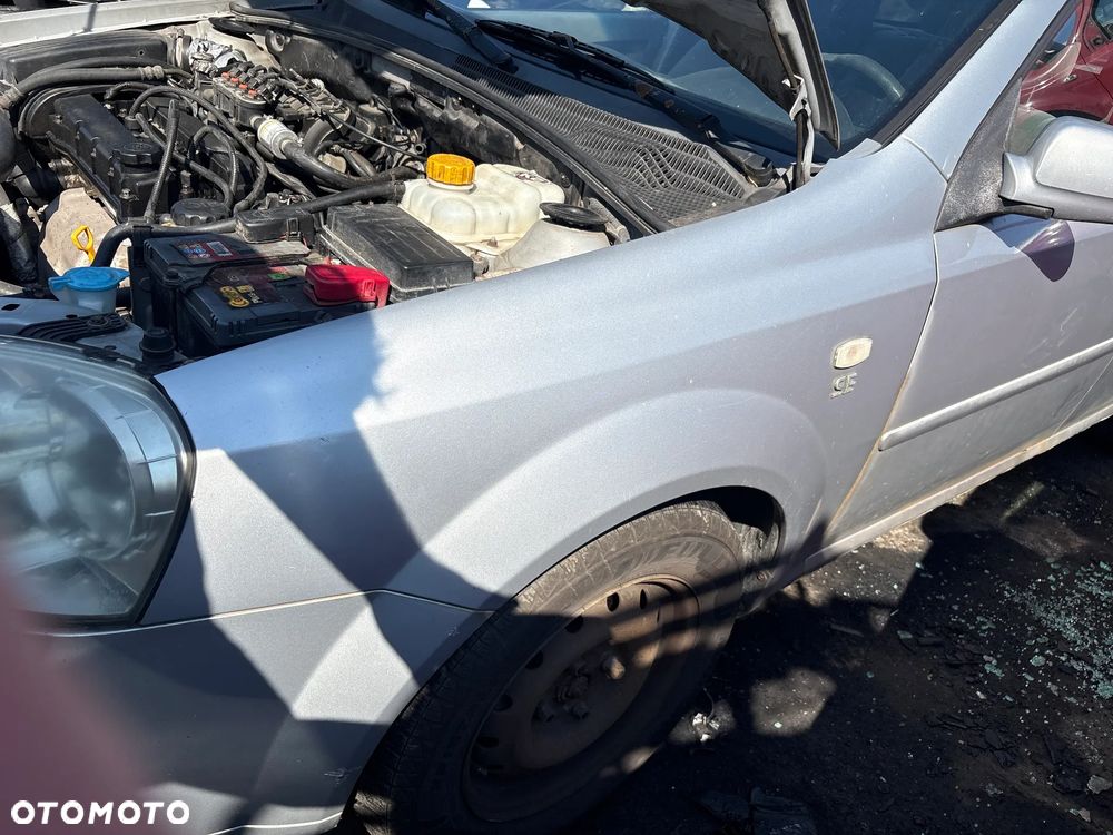 BŁOTNIK LEWY CHEVROLET NUBIRA, LACETTI 2006R LAKIER 92U - 1