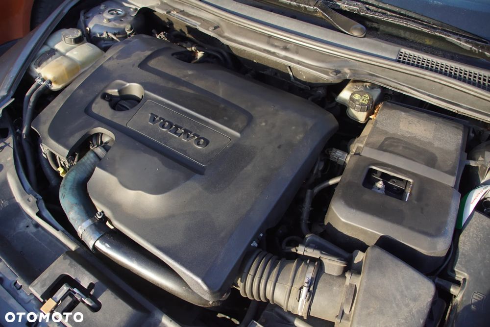 Auto na części - Volvo S40 II 1.6 D 109 KM D4164T MTX75 455 2006R Silnik Skrzynia Drzwi Błotnik Klapa Zderzak Lusterko Szyba Klamka Deska Kokpit Sterownik Moduł Czujnik Licznik Kierownica Wyświetlacz Panel - 18