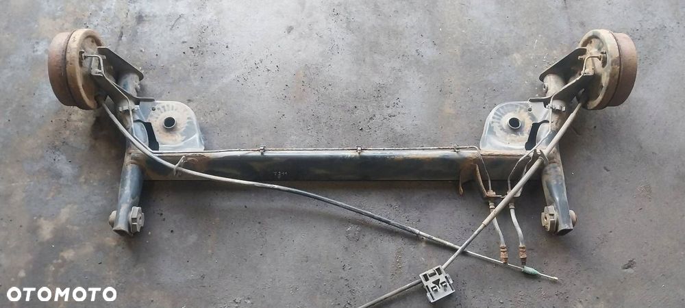BELKA OŚ ZAWIESZENIA TYŁ BĘBNY BEZ ABS RENAULT THALIA I - 2