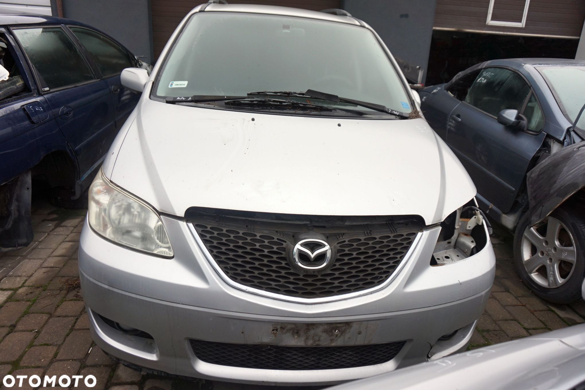 MASKA ZDERZAK BŁOTNIKI LAMPY MPV II LW LIFT 22V  MAZDA 2004-2006 SREBRNY PRZÓD KOMPLETNY - 1