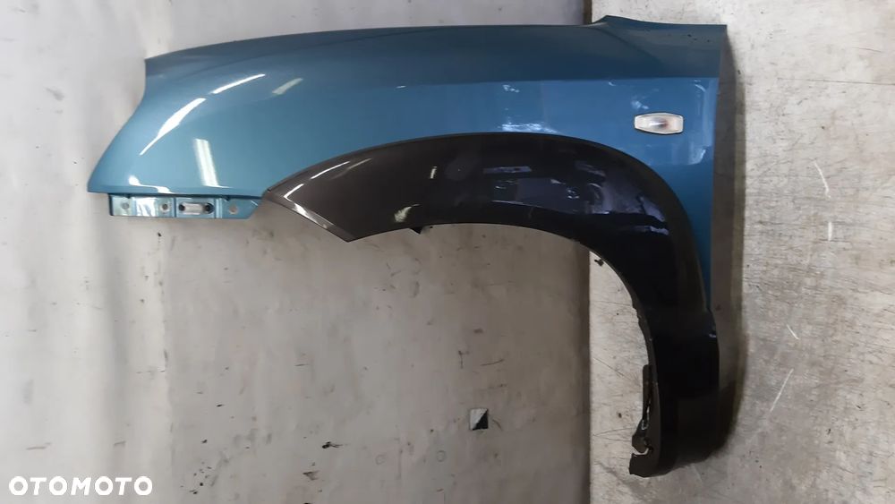* Hyundai Tucson I 1 błotnik LEWY przedni przód MORSKI KOLOR HE - 1