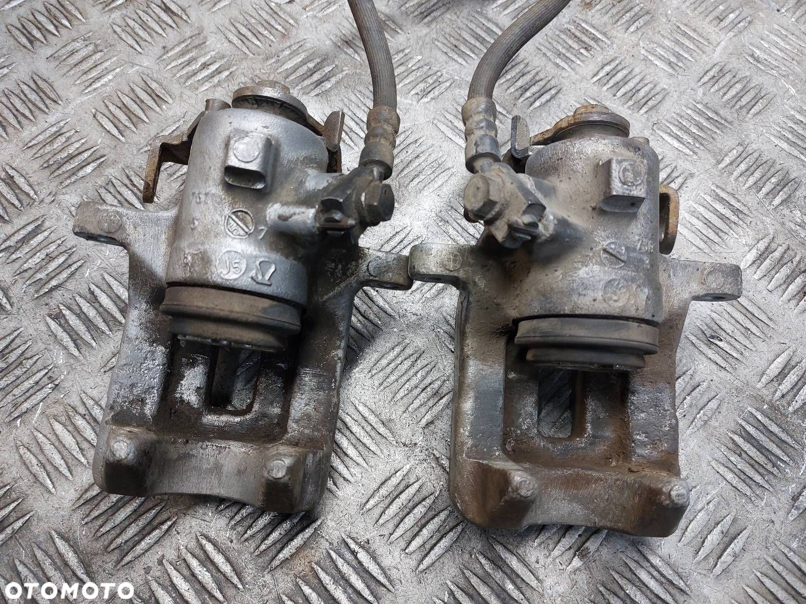 TARCZE HAMULCOWE TYŁ + KLOCKI + ZACISKI AUDI A4 B7 2.0 TDI - 10