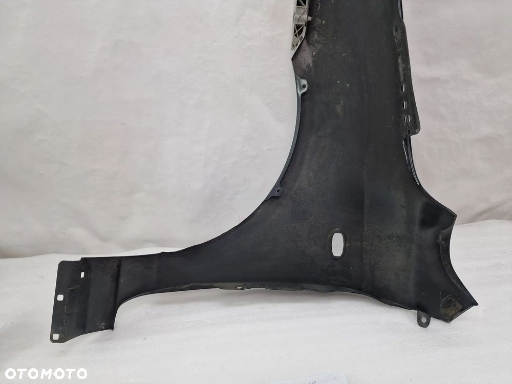 MAZDA 2 03-07 PRAWY BŁOTNIK PRZEDNI PRZÓD , NR AUKCJI BŁ215 - 16