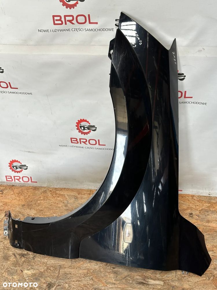 BŁOTNIK PRZEDNI LEWY KIA SORENTO 06-09 EB