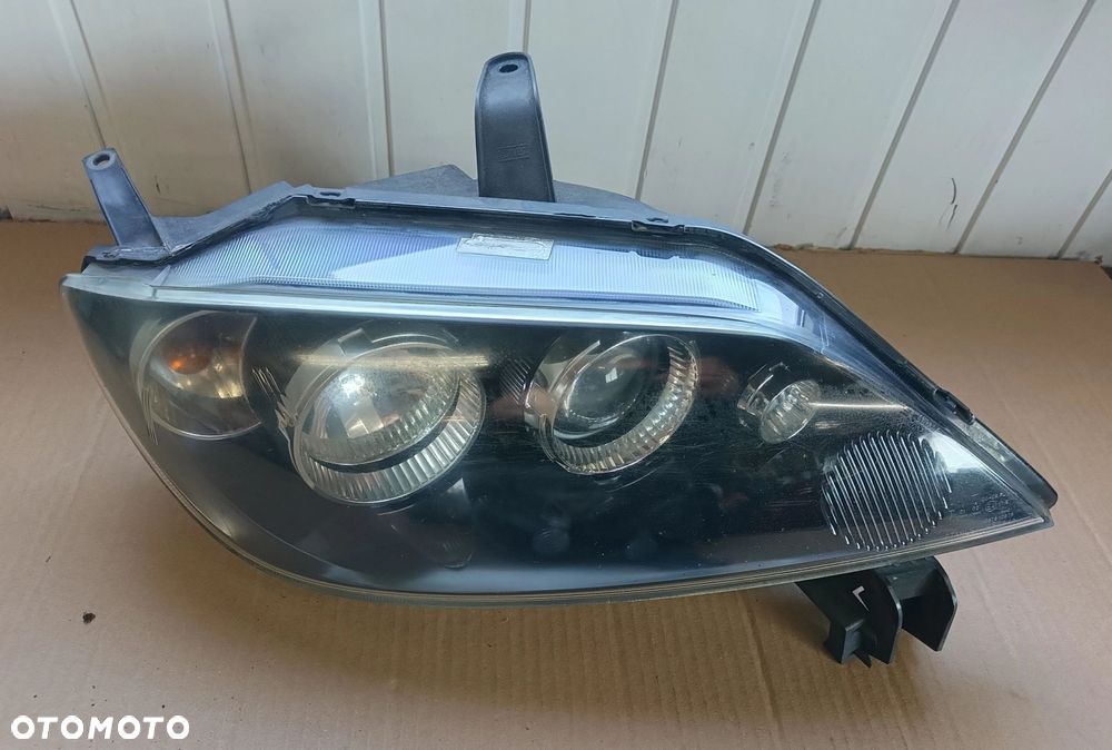 Mazda II 2 lampa przednia przód Europa LIFT stan bdb bez uszkodzeń 2005-07r - 2