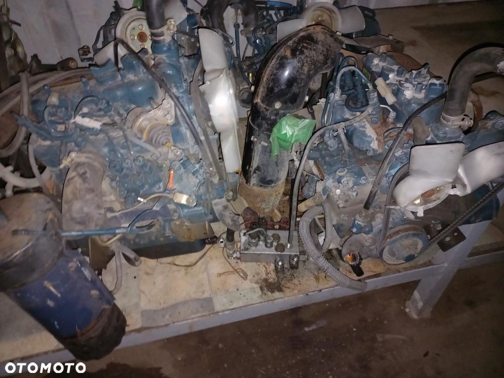 Silnik kubota V3800-DI-T-ET10, 7KBXL,BKBXL03,blok,głowica,turbo,wał,korbowód,tłok,koło rozrządu,zamachowe,wałek,1G5970461,TD04 HL,1G574,V33,V3600,V3800,D662,ISEKI,YANMAR,wtryski,pompa wtryskowa,kompletny silnik,obudowa,E4CG,C18W,V1505D. - 17