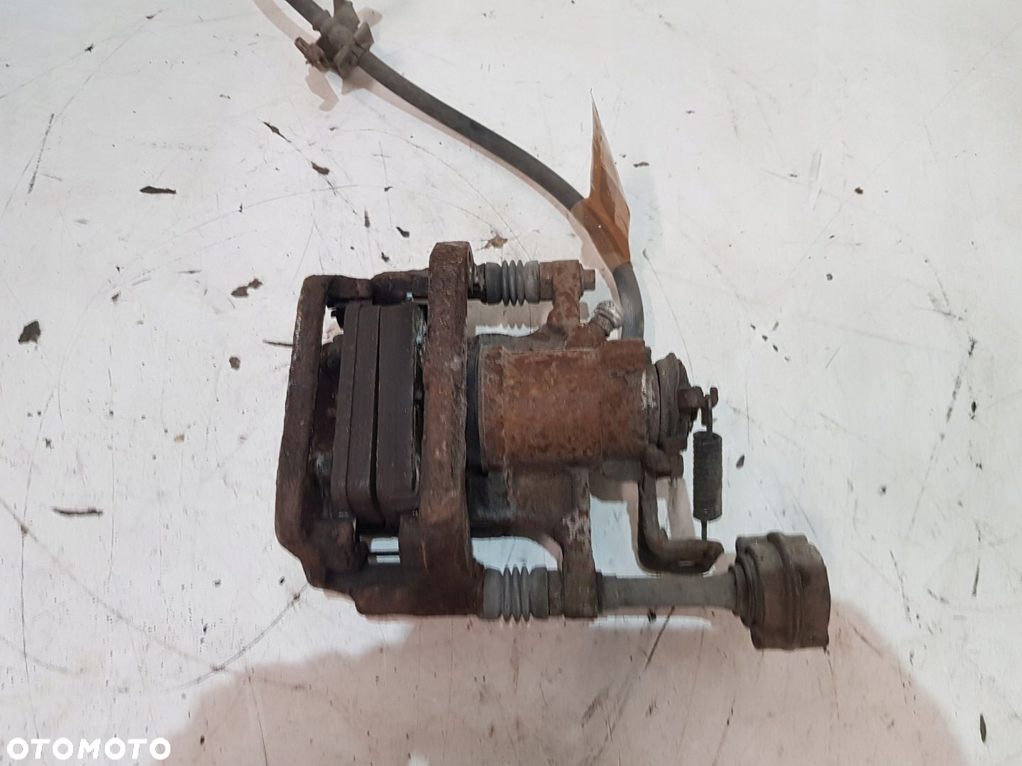 ZACISK HAMULCOWY PRAWY TYŁ OPEL ASTRA J EUR - 13