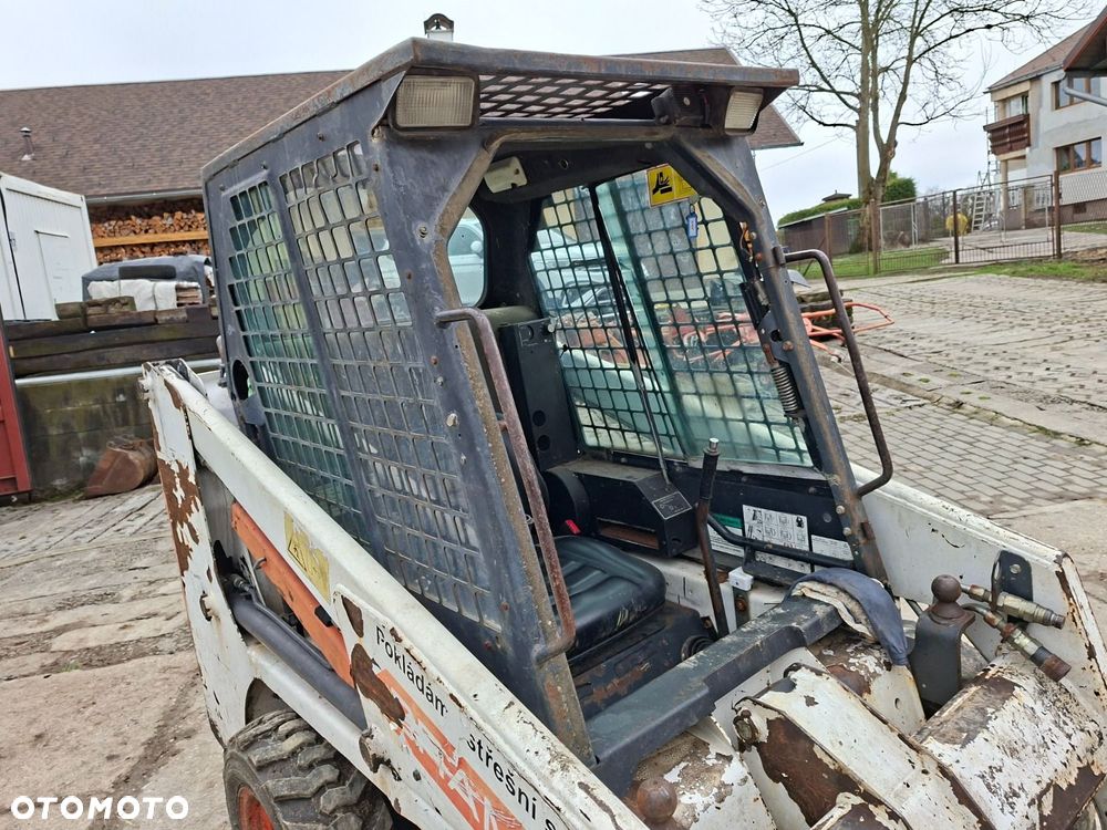 Bobcat 553 4X4 + Melroe Ingersoll-Rand 725S B/H - 23